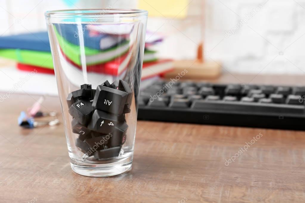 Keyboard buttons in glass on office table. April fools day celebration