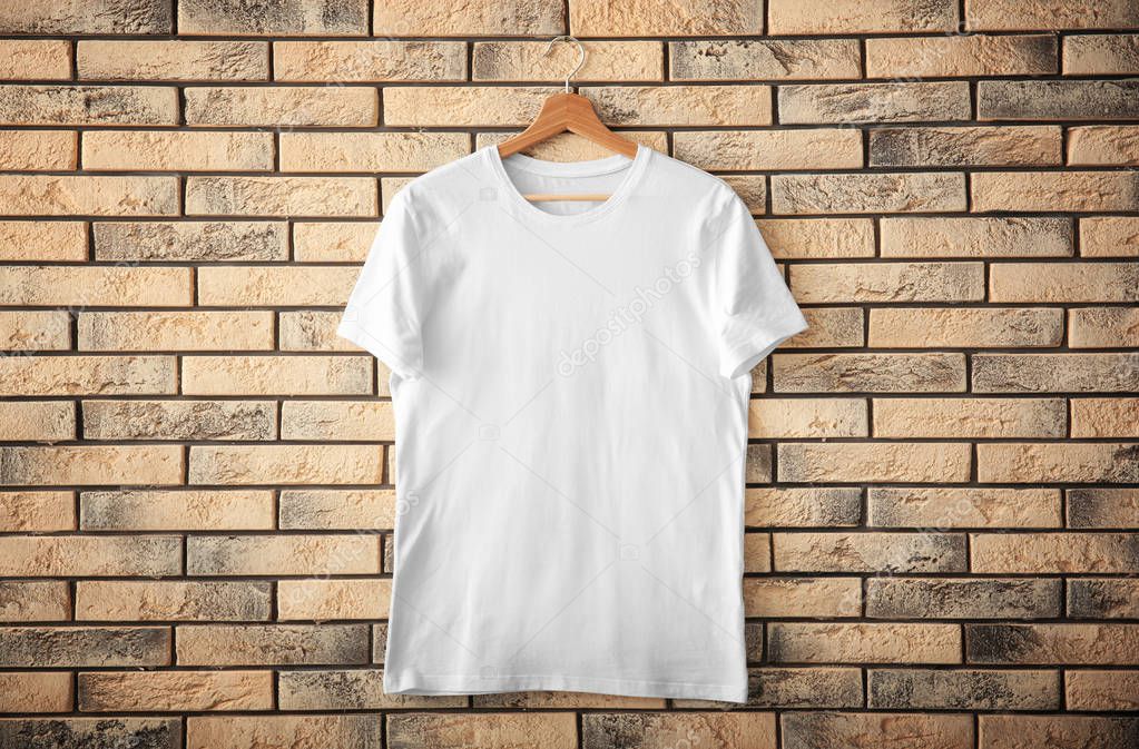 Download White t-shirt on brick wall background. Mockup for design ...