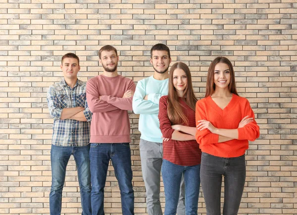 Group of young people standing together, indoors. Unity concept — Stock Photo, Image