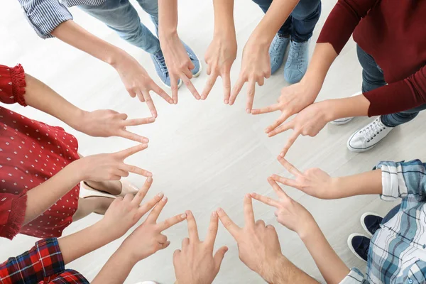 Young people making circle with their hands as symbol of unity — Stock Photo, Image