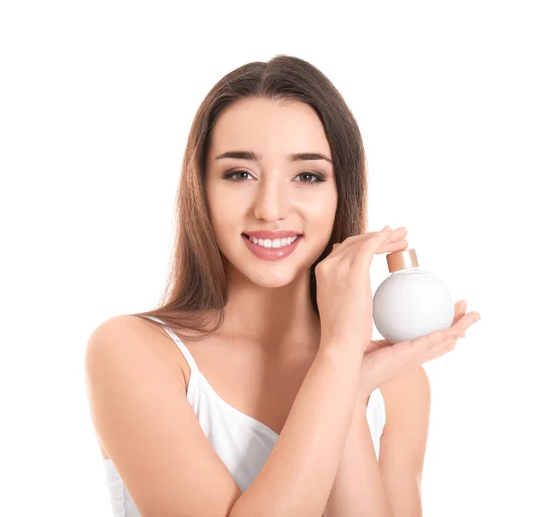 Mujer joven con botella de crema de manos sobre fondo blanco — Foto de Stock