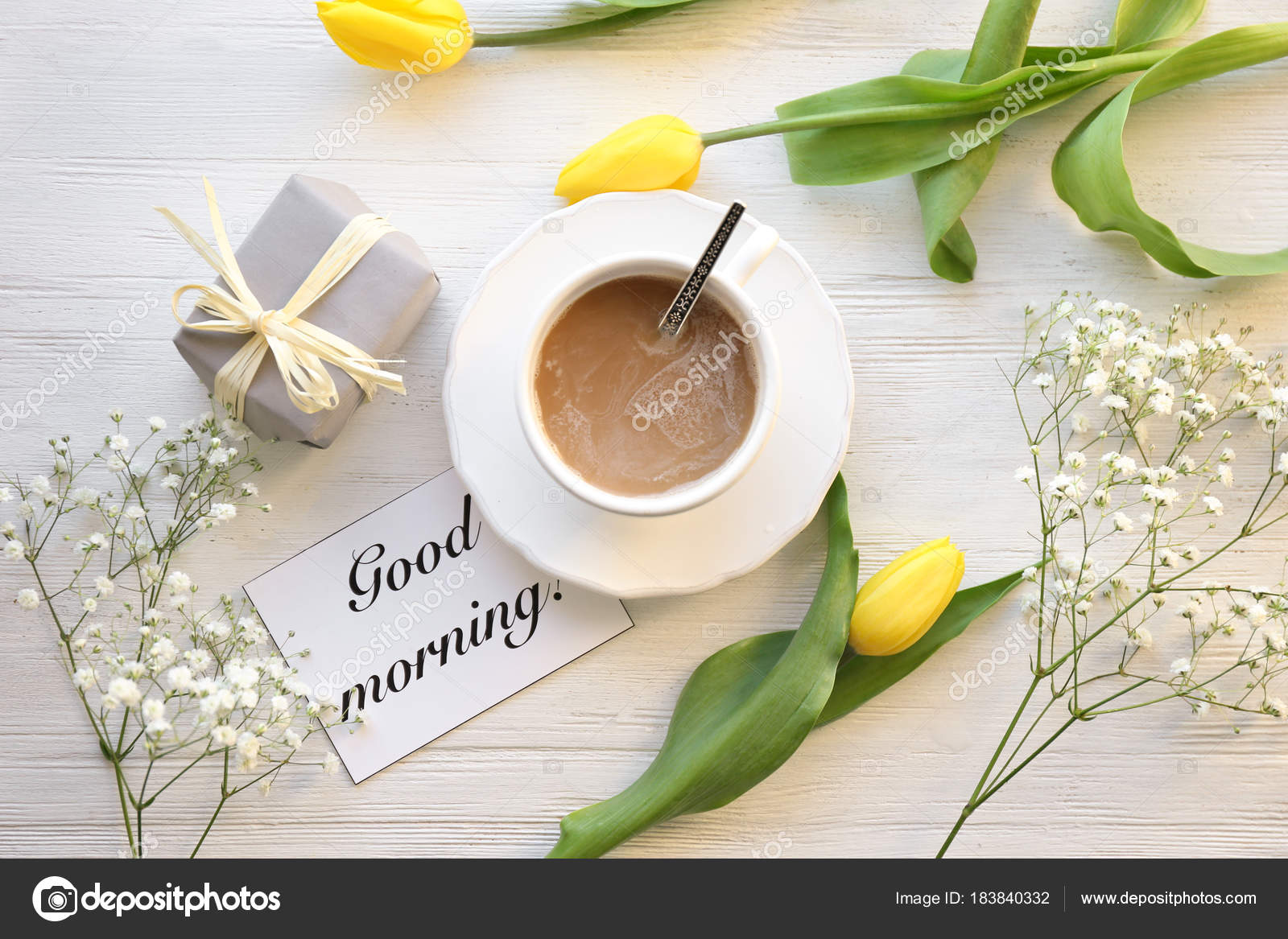 Cup of coffee for breakfast, gift, flowers and card with words 