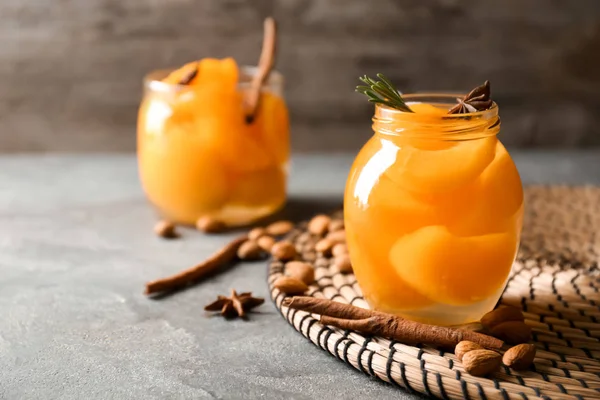 Jar with pickled apricots on table — Stock Photo, Image