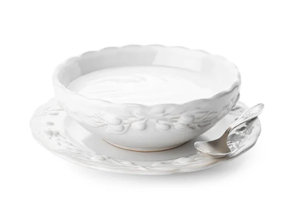 Tasty yogurt in dish on white background — Stok Foto
