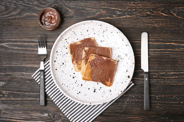 Plate with toasted bread on table — Stock Photo, Image