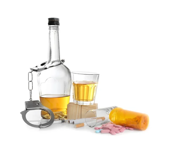 Alcohol, cigarettes, drugs and handcuffs on white background — Stock Photo, Image