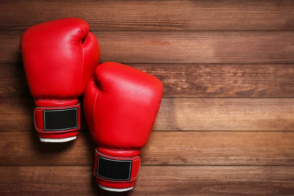 Boxing gloves on wooden — Stock Photo, Image