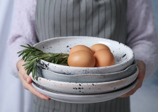 Woman Holding Plates Chicken Eggs Rosemary Closeup — Stock Photo, Image