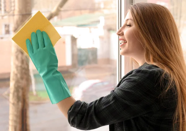 Young Woman Cleaning Window Indoors — Stock Photo, Image