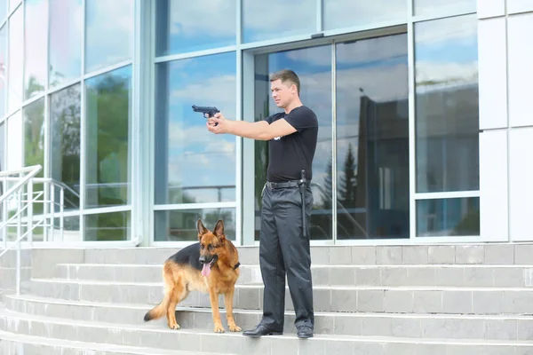 Security guard with dog — Stock Photo, Image