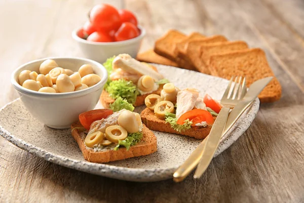 Plate with tasty chicken bruschettas — Stock Photo, Image