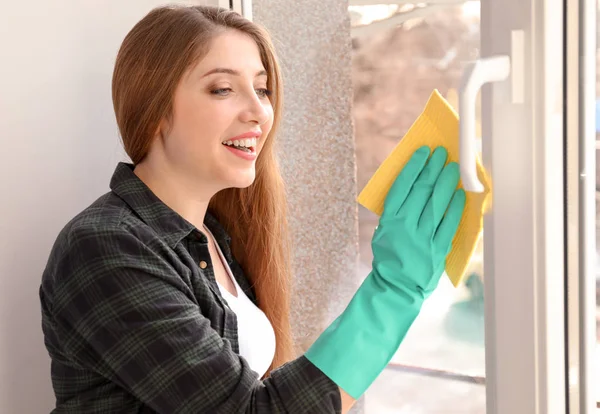 Young Woman Cleaning Window Indoors — Stock Photo, Image