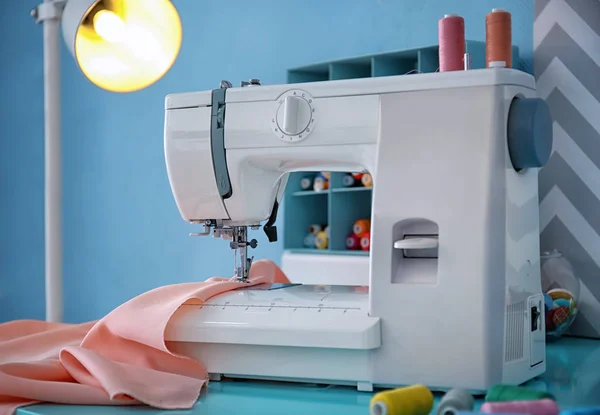 Sewing machine with fabric — Stock Photo, Image