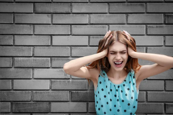 Depressed Young Woman Brick Wall Background — Stock Photo, Image