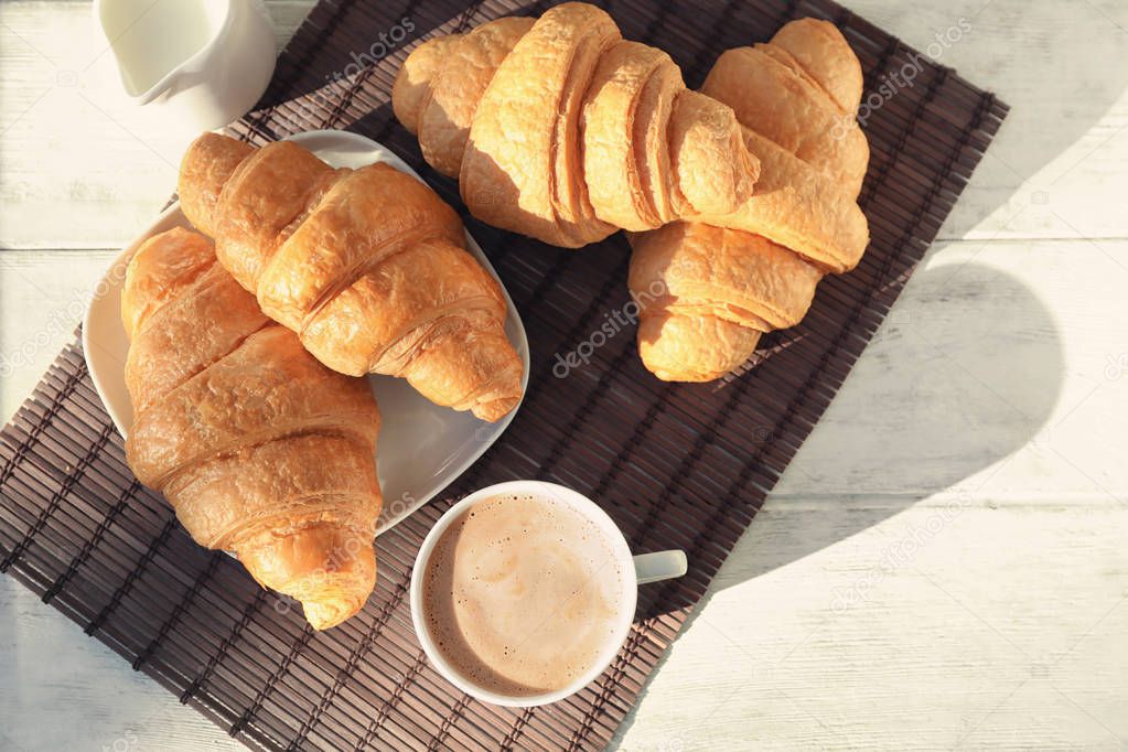 Delicious croissants with coffee 
