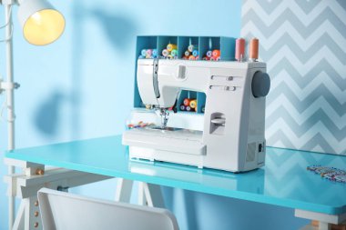 Sewing machine with fabric  clipart