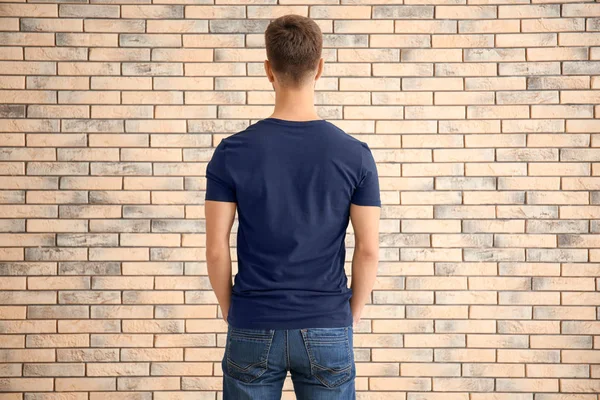 Young Man Stylish Shirt Brick Wall Mockup Design — Stock Photo, Image