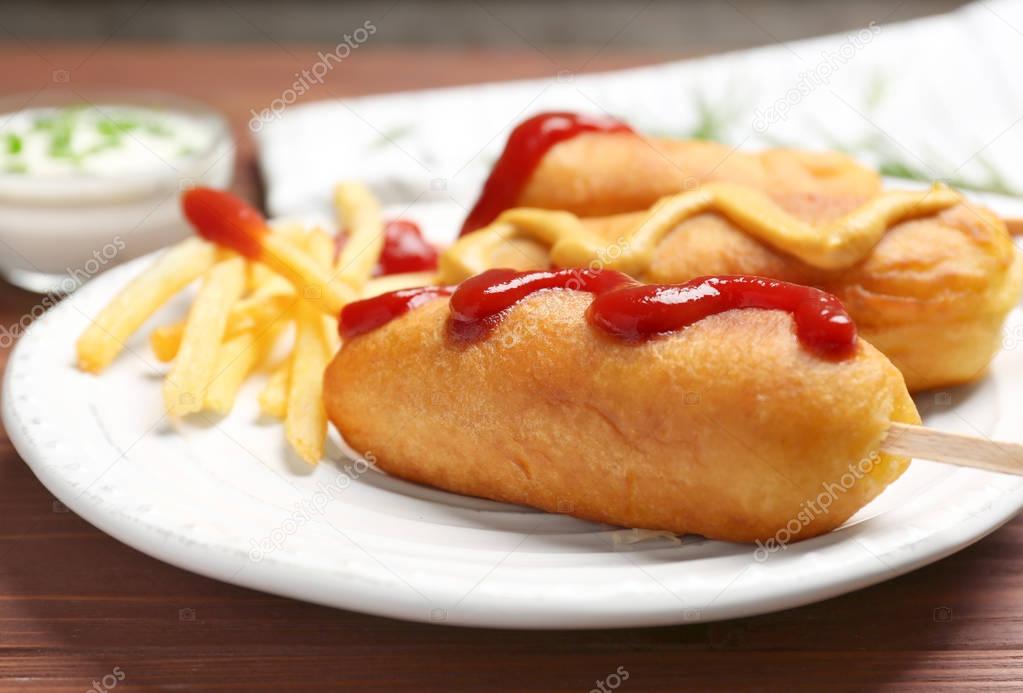 Tasty corn dogs with sauces
