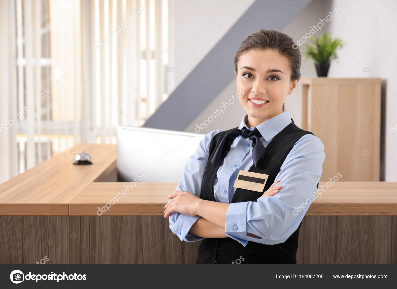 Female Hotel Receptionist Workplace Stock Photo by ©belchonock 184087206