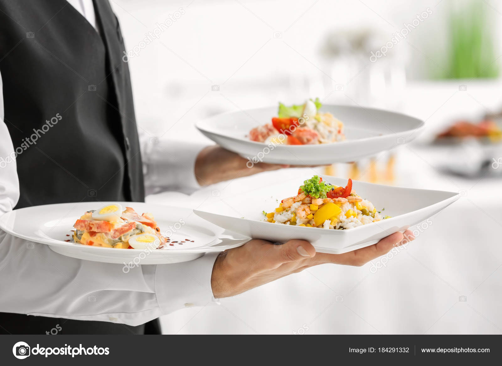 Waiter holding plates — Stock Photo © belchonock 184291332