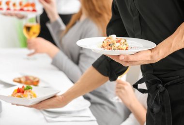 Waiter serving tasty dishes  clipart