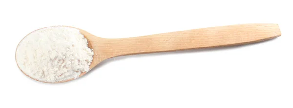 Wooden spoon with wheat flour — Stock Photo, Image