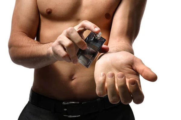 Handsome man with bottle of perfume — Stock Photo, Image