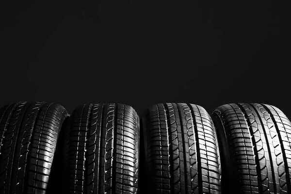 r tires on black background
