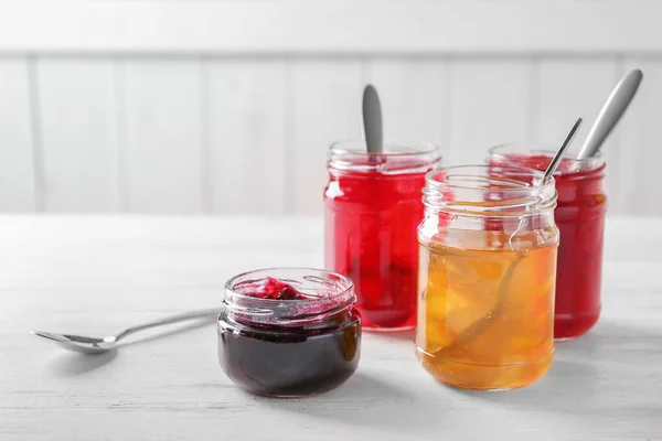 Jars with sweet jams — Stock Photo, Image