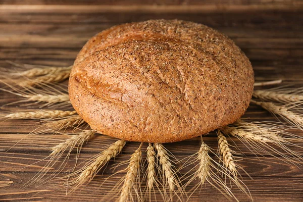 Fresh tasty bread and spikelets — Stock Photo, Image