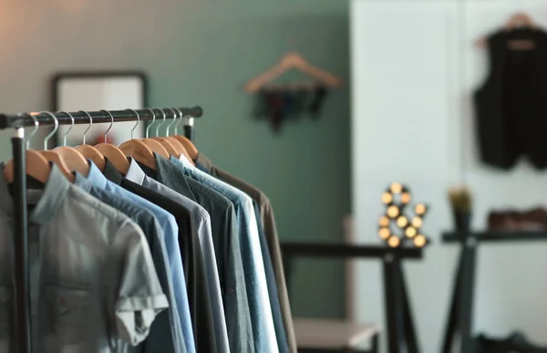 Clothes rack with many shirts — Stock Photo, Image