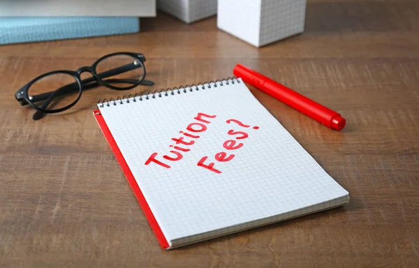 Notebook with question "Tuition fees?" — Stock Photo, Image