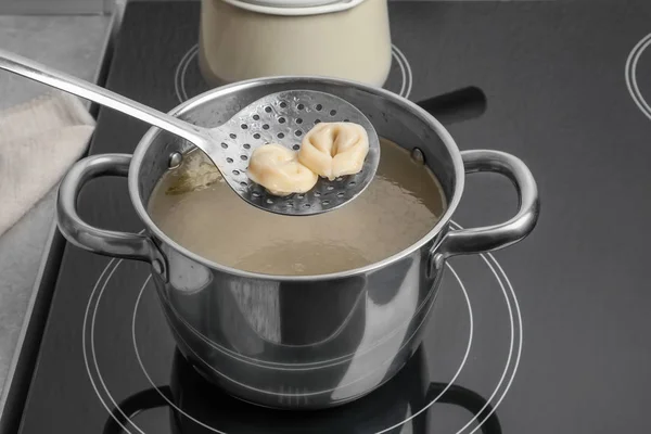 Cooked dumplings on skimmer — Stock Photo, Image