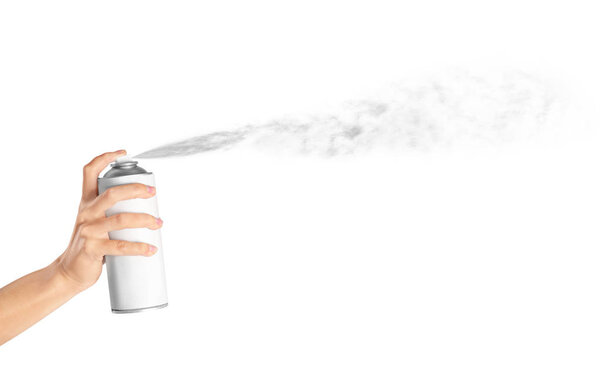 Woman spraying paint from can 