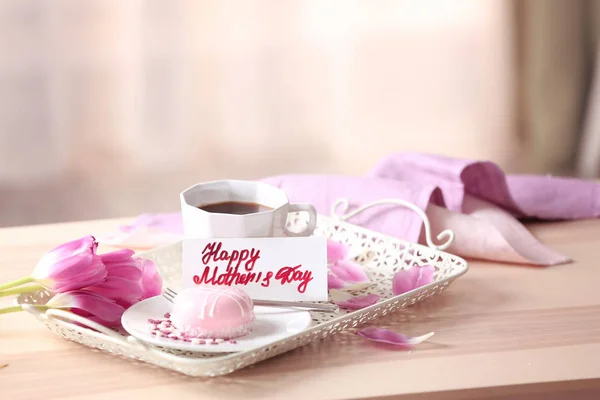 Tasty dessert and cup of coffee with card — Stock Photo, Image