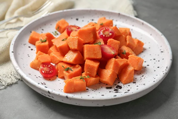 Plate with delicious cut sweet potatoes — Stock Photo, Image