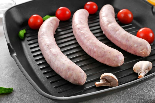 Grill pan with delicious sausages — Stock Photo, Image