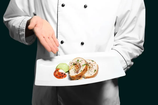 Male chef holding plate with tasty dish, closeup — Stock Photo, Image