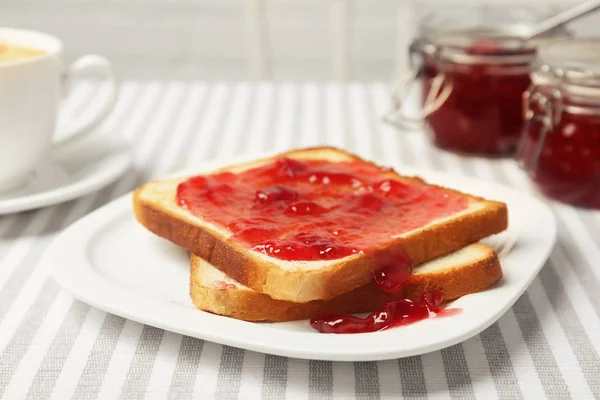 Delicious toast with sweet jam served for breakfast on table — Stock Photo, Image