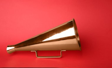 Vintage megaphone on color background clipart