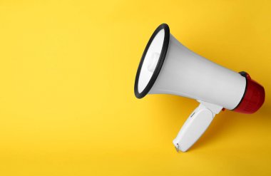 Electronic megaphone on color background clipart