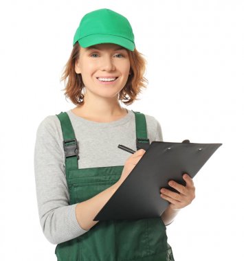 Female auto mechanic with clipboard and pen on white background clipart