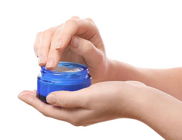 Woman with jar of body cream on white background — Stock Photo, Image