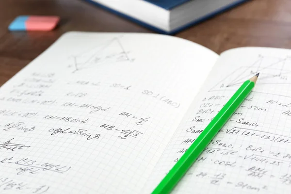 Exercise book with homework on table, closeup — Stock Photo, Image