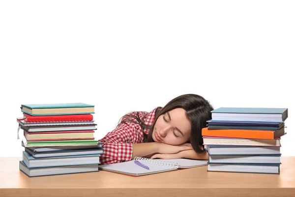 Durmiendo adolescente chica cansado de hacer la tarea contra fondo blanco —  Fotos de Stock