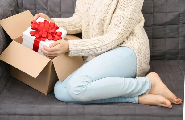 Woman taking gift box — Stock Photo, Image