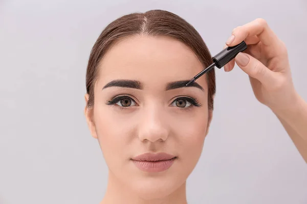 woman undergoing eyebrow correction procedure