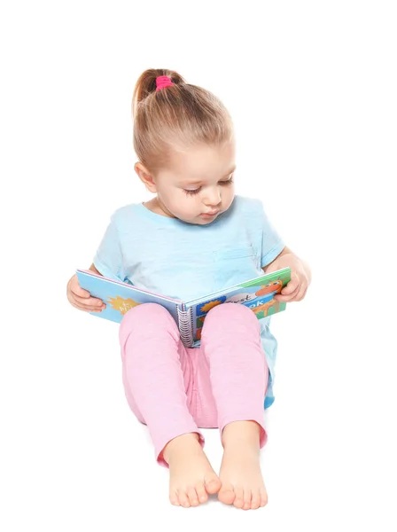 Cute little girl reading book on white background — Stock Photo, Image