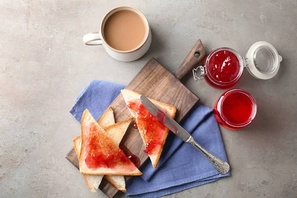 Delicious toasts with sweet jam on wooden board — Stock Photo, Image
