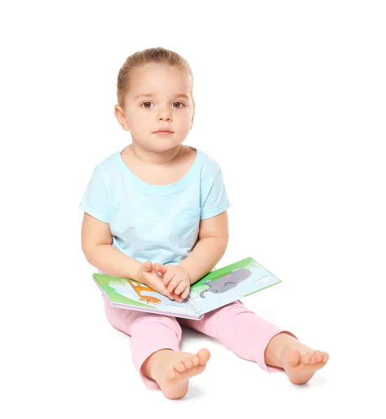 Cute little girl reading book on white background — Stock Photo, Image